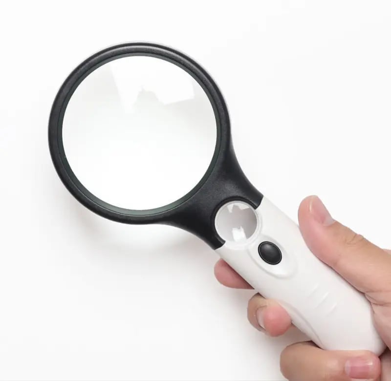 A 10x handheld 3-lamp LED magnifying glass for reading and magnifying jewelry